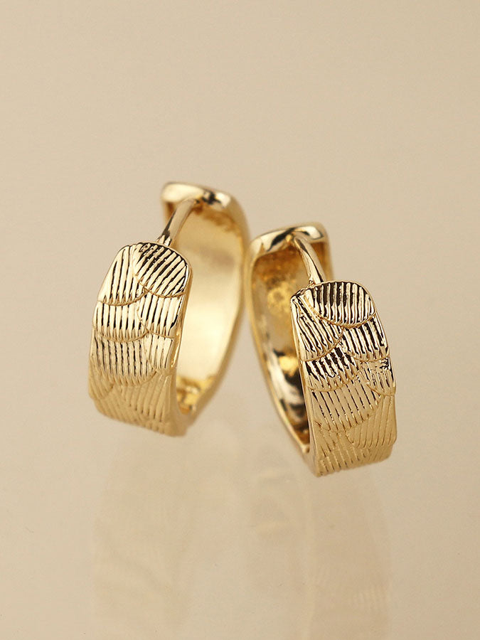 Faux Gold Scallop Embossed Huggie Hoops – stylish accessories from C&K, an independent lifestyle store in Settle, North Yorkshire.