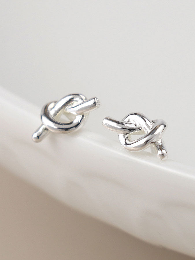 Silver Plated Tiny Knot Studs – stylish accessories from C&K, an independent lifestyle store in Settle, North Yorkshire.
